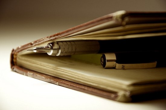 Image of pen and pencil inside journal by rafaelsoares, via Flickr