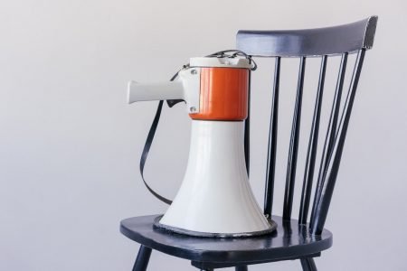 Image: a megaphone placed on a chair