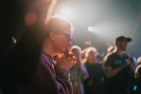 Image: smiling audience members at a live performance