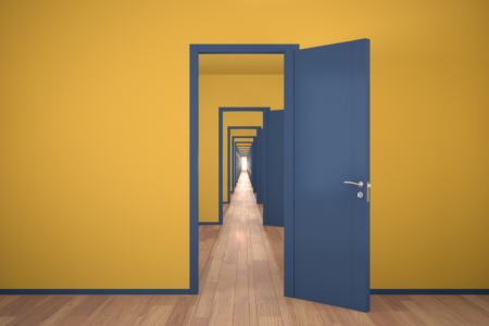 Image: A blue door is set into a yellow wall. Through that open door can be seen another blue door in another yellow wall, and on and on, into infinity.