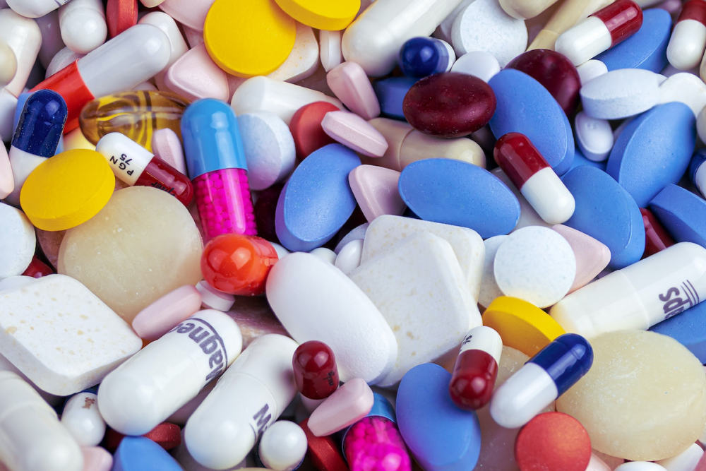 Image: a colorful pile of pharmaceutical pills