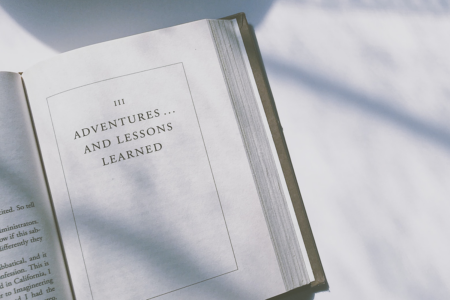 Image: an open spread from a hardcover copy of the book The Last Lecture by Randy Pausch and Jeffrey Zaslow, showing the beginning of Part III titled "Adventures…and Lessons Learned."