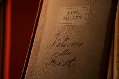 Image: a vintage, clothbound volume of Jane Austen's work in a bookshop in Oxford, UK.