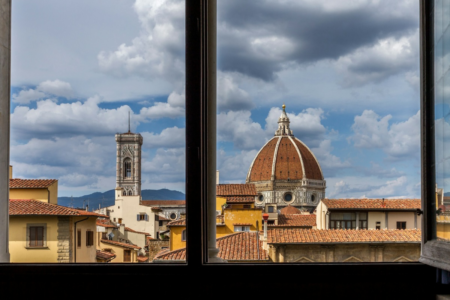 Image: Florence, Italy's Il Duomo as seen through the open windows of a historic hotel room.