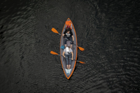 Image: bird's-eye view of a couple in a kayak