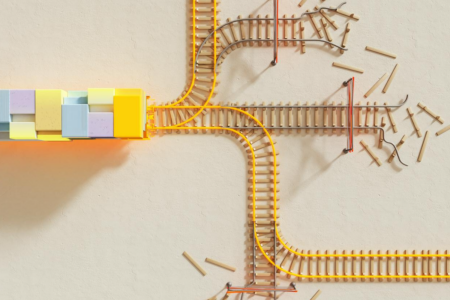 Image: a toy train laden with cargo sits in front of a juncture where three branches of tracks result in dead-ends but two others remain available.