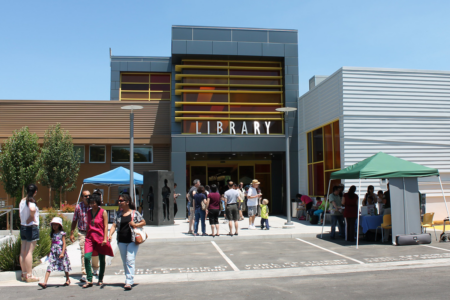Image: patrons are gathered in groups outside the Calabazas Branch Library Grand Opening event in San José, California in 2013.