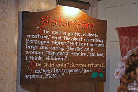 Image: at the downtown Philadelphia Macy's immersive 'A Christmas Carol' installation in 2013, a handpainted sign relates an excerpt of the Dickens story. Under the heading Sister Fan is the text: "She was a gentle, delicate creature, said the ghost describing Scrooge's sister. But her heart was large and caring. She died as a woman, the ghost recalled, and had, I think, children. One child only, Scrooge returned. Yes, was the response, your nephew, Fred."