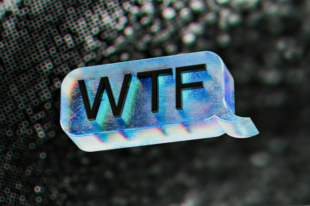 Image: a 3D rendering of a speech bubble appearing to be made from a cold, blue block of ice, bearing the letters WTF.